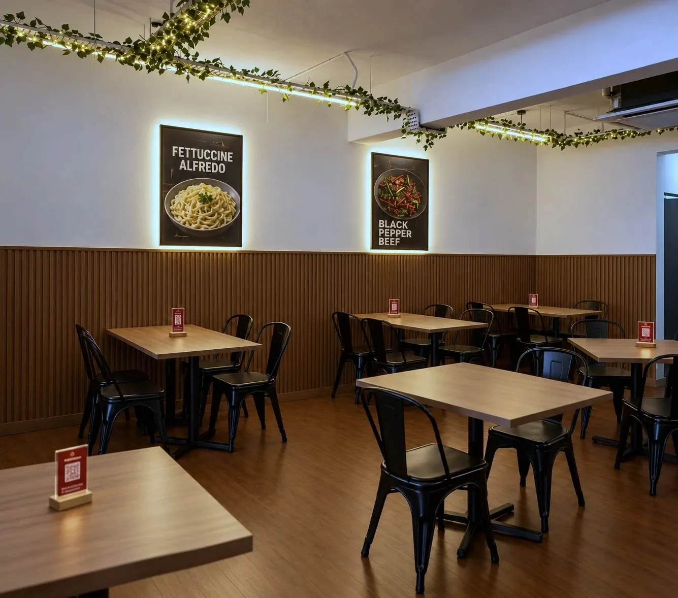 Tables along the wood-panelled wall at Kiya's